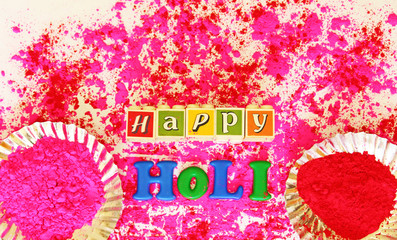 powder color and happy holi message on white background 