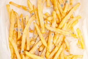 Bad spoiled food. French fries with green mold