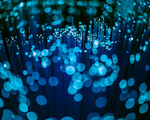selective focus of glowing blue fiber optics texture with bokeh