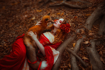 Woman in medieval clothes with a fox