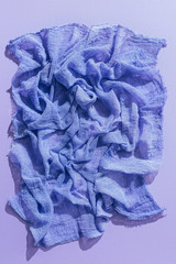 top view of purple gauze fabric on purple backgroundtissue