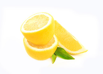Fresh lemon with half and leaves isolated on white background