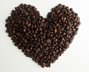 Roasted coffee beans in shape of heart