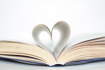 Book with love symbol isolated on white background