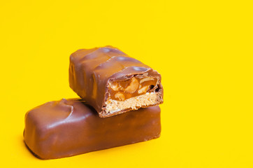 chocolate bars on a yellow background. sweets, candy