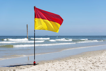 Red and yellow warning sign flag