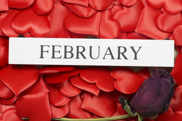 Wooden calendar show of 14th February with red heart 