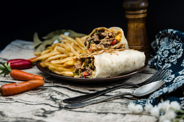 Mexican fajita wraps with grilled chicken fillet and fresh vegetables