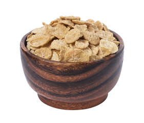 Corn flakes in wooden bowl isolated on white