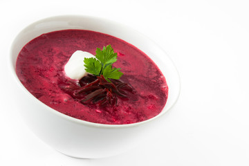 Beet soup in white bowl isolated on white background

