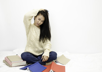 Asian women strained with books on the floor.Lady stress book