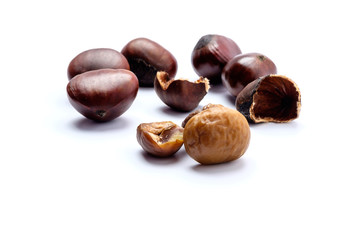 Roasted chestnuts on a white background.