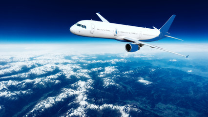 Obraz na płótnie Canvas Airplane over the clouds