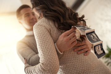 Beautiful young couple expecting baby