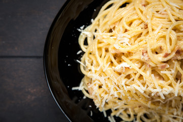 Spaghetti carbonara with egg and pancetta