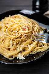 Spaghetti carbonara with egg and pancetta