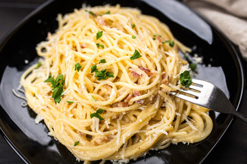 Spaghetti carbonara with egg and pancetta