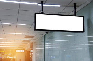 hanging blank advertising billboard or light box showcase on wall at airport or subway train station, copy space for your text message or media content, advertisement, commercial and marketing concept