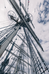 Fototapeta premium Old sailing ship mast. Tall ship rigging detail. Masts and rigging of a sailing ship