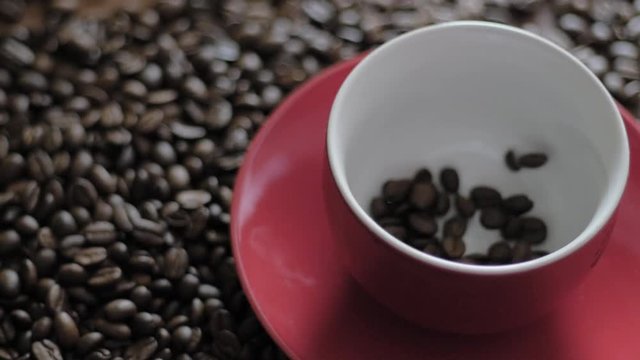 coffee beans dropping into cup