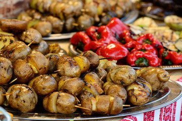 Grilled potato on a plate. Popular street food
