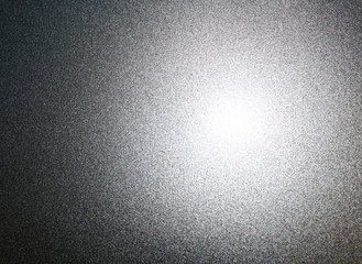 Silvery metal surface with glare
