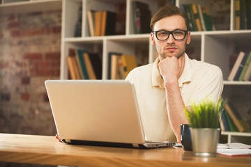 Fototapeta premium Young man with a laptop