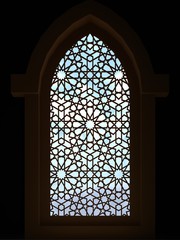 Islamic interior design of the mosque. Islamic window with traditional pattern. Background greeting cards Ramadan Kareem. 3D rendering.