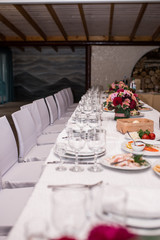 Empty glasses set in restaurant. Wineglasses served for a festive dinner. Banquet table