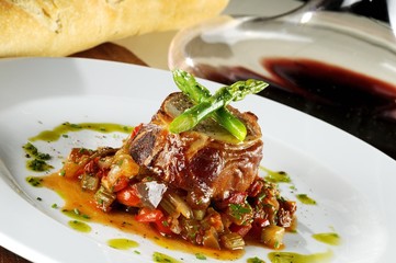 Rabbit stuffed with pistachio, asparagus and veal accompanied by ratatouille.