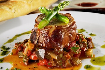 Rabbit stuffed with pistachio, asparagus and veal accompanied by ratatouille.