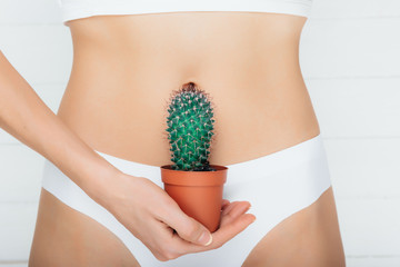woman dressed in underwear, suffering from stomach ache , gastritis or menstruation, stomach...