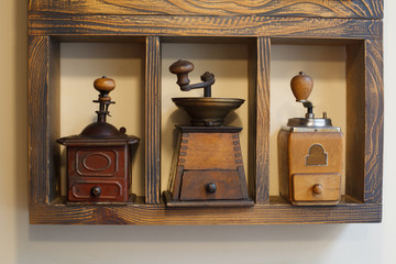 Coffee grinders on shelve. Retro collection of coffee grinders.
