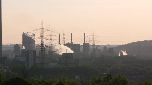 Essen industry with smokestacks in evening sun