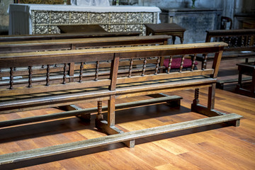 Obraz na płótnie Canvas Chapel, benches to pray inside a church. concept of faith and religion