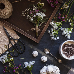 Composition with flowers, coffee and marshmallow cookies. The conception of wedding or birthday