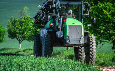 Fototapeta premium tractor on the field eco background