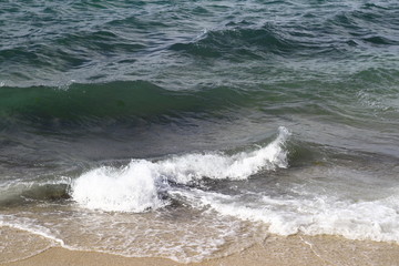 Emerald waves near the coast