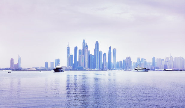 Dubai waterfront skyline, color toning applied, United Arab Emirates.