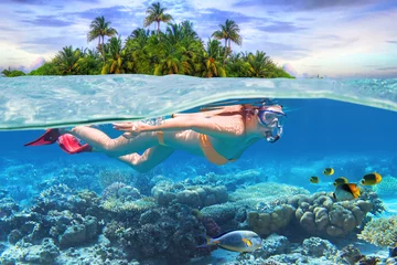 Fotobehang Young woman at snorkeling in the tropical water © Patryk Kosmider