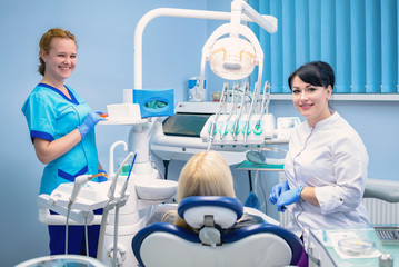 The dentist treats the patient in the clinic