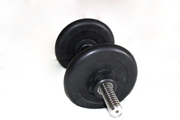 Black big dumbbells, on a white background.  Close-up