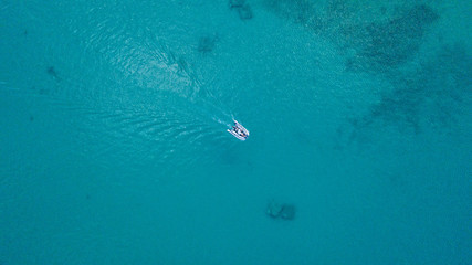 Aerial view of sculler in open water. © Jag_cz