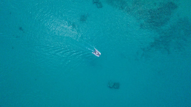 Aerial view of sculler in open water.