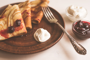 pancakes with sour cream and cherry jam