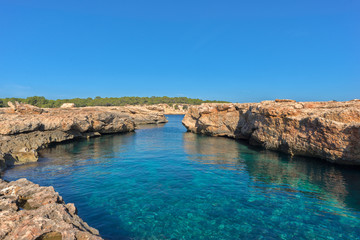 Obraz na płótnie Canvas The coast on a blue day in Ibiza