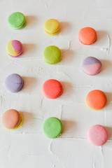 multicolored macaroons on light background, geometric layout