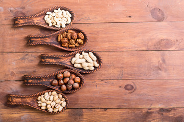Mix of nuts in wooden spoon
