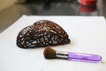 How to Bake Cake in the shape of heart on Valentine's Day. Close-up, chocolate cover