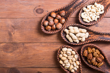 Mix of nuts in wooden spoon